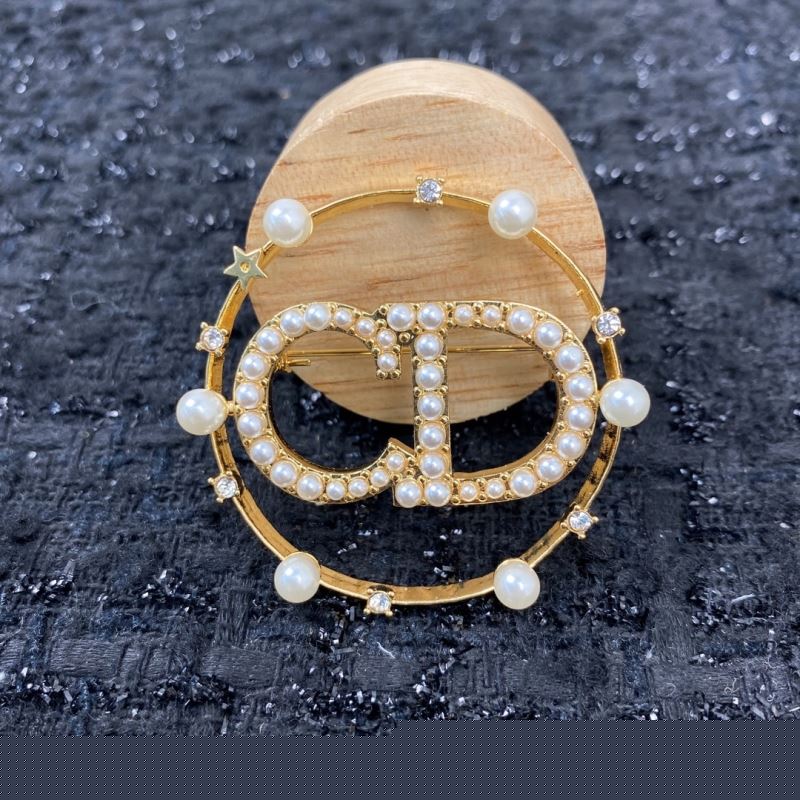 ch**an D*or brooches